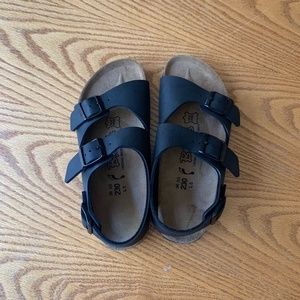 Double-strap black Birkenstocks with heel strap